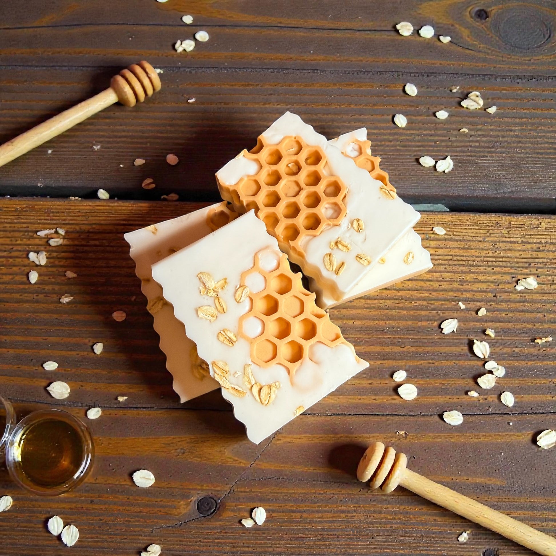 Rectangle shea butter soap with oatmeal, milk, and honey scent, decorated with orange honeycombs and oats