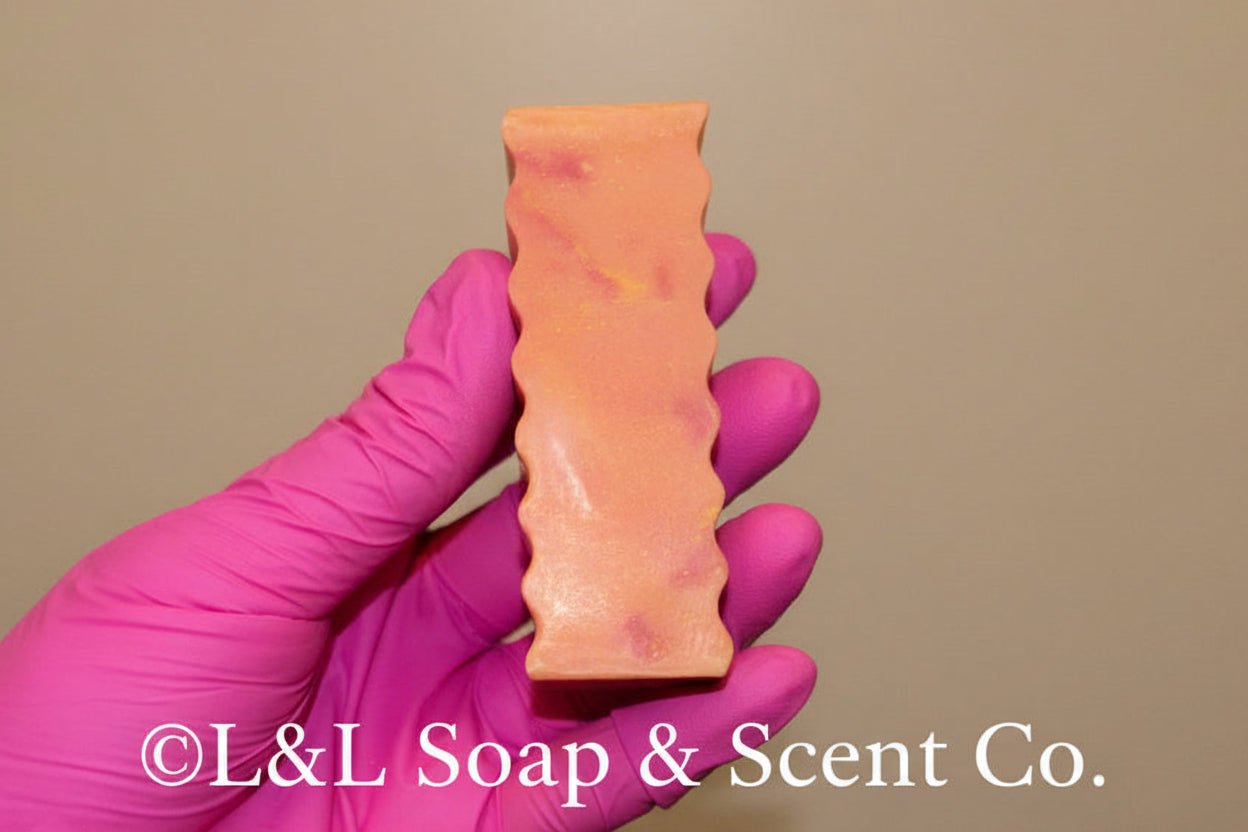 Rectangle-shaped shea butter soap with pink and orange swirls, strawberry scente